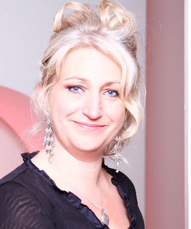 Zoe Partington wearing a black top smiles at the camera