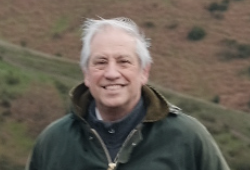 a man smiles at the camera